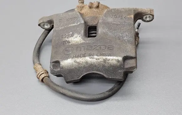Mazda 3 III Front brake caliper