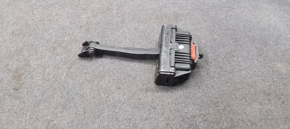 Front door check strap stopper
