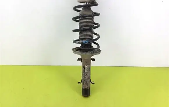 Volkswagen Golf IV Front shock absorber with coil spring 1J0413031S