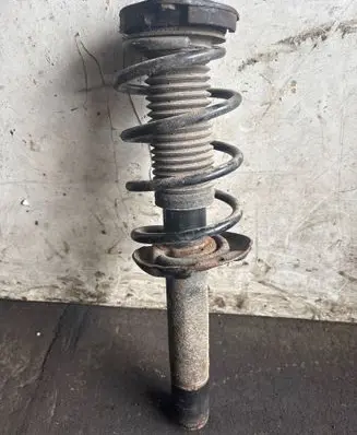 Volkswagen Golf V Front shock absorber with coil spring
