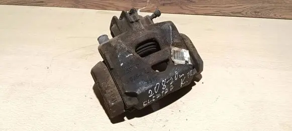 Peugeot 208 Front brake caliper 7703512636
