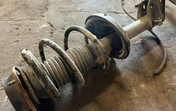 Subaru Outback Front shock absorber with coil spring
