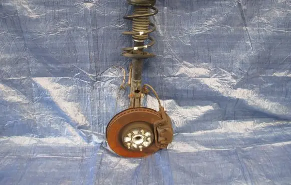 Front wheel hub spindle knuckle