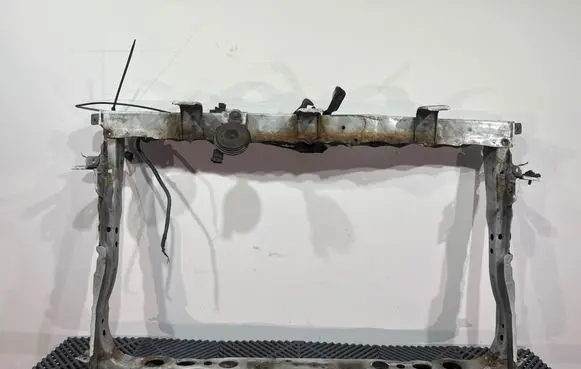 Top upper radiator support slam panel