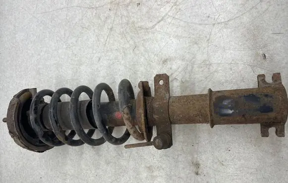 Nissan Primastar Front shock absorber with coil spring