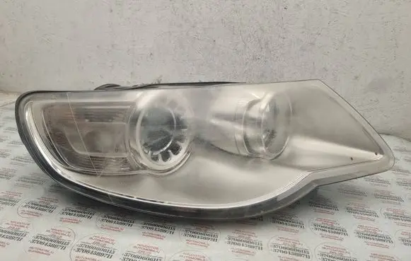 Volkswagen Touareg I Headlight/headlamp 7L6941032