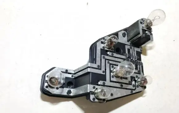 Tail light bulb cover holder