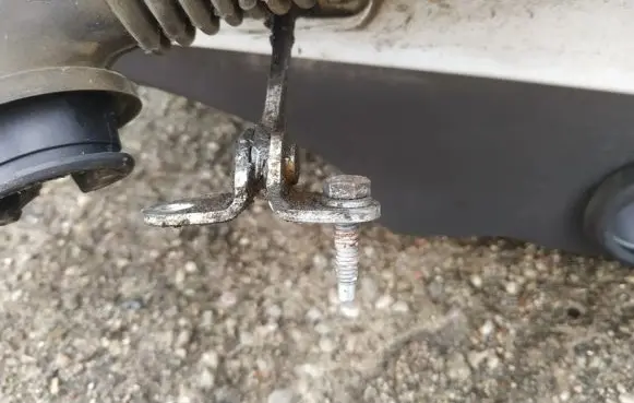 Front door check strap stopper