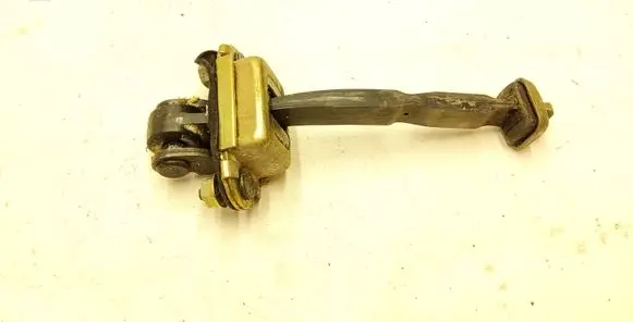 Front door check strap stopper