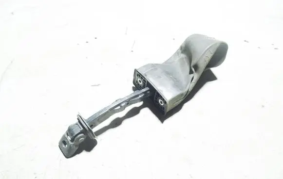Front door check strap stopper