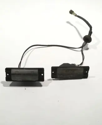 Mitsubishi Pajero Sport I Number plate light 1141261 E291043 91043