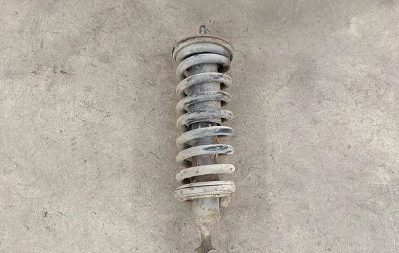 Nissan Navara D40 Front shock absorber with coil spring