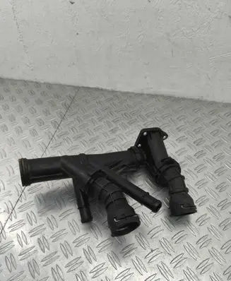 Volkswagen Touran III Engine coolant pipe/hose 04L121071E 04L121026F