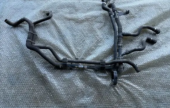Volkswagen Touareg II Engine coolant pipe/hose 7P0121070AB 7P0122051D 7P0121101A