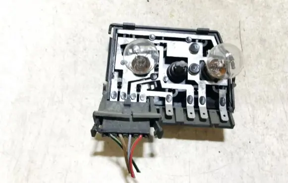 Tail light bulb cover holder