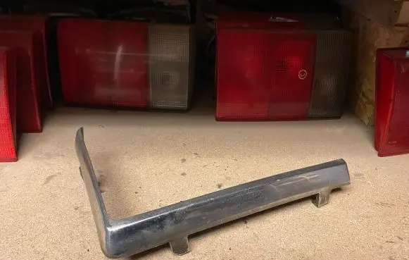Volvo 240 Under headlight/headlamp trim 1259251 1259405