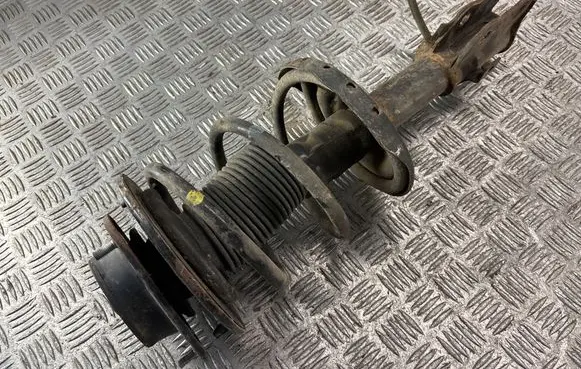 Subaru Impreza III Front shock absorber with coil spring