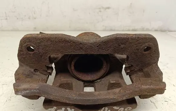 Mazda 323 F Front brake caliper