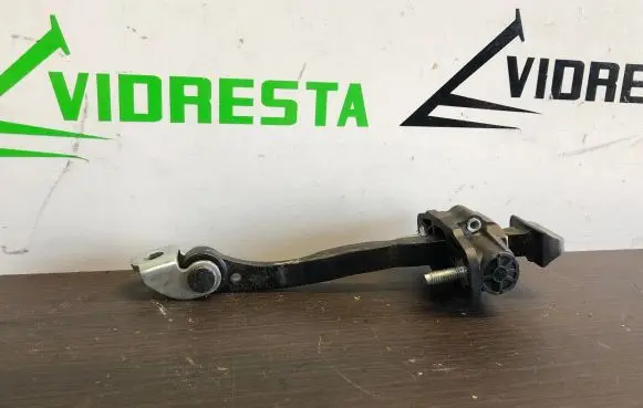 Front door check strap stopper