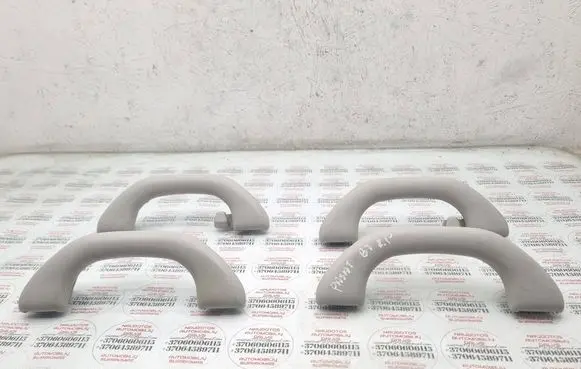 Volkswagen PASSAT B7 A set of handles for the ceiling 1K0857607M