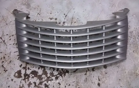 Chrysler PT Cruiser Front bumper upper radiator grill 27784