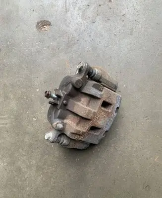 Subaru Outback (BT) Front brake caliper 