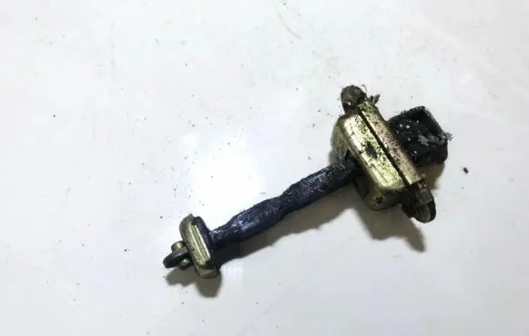 Front door check strap stopper