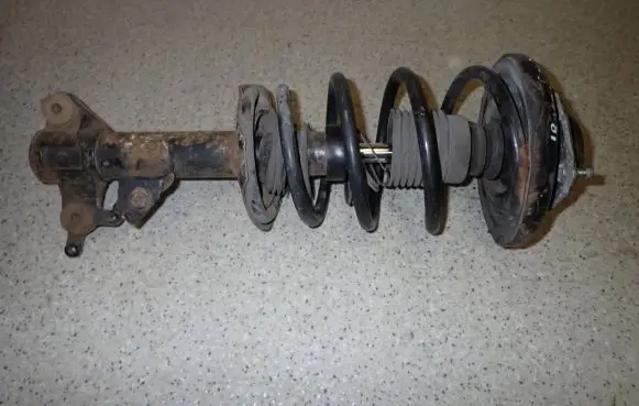 Nissan Primera Front shock absorber with coil spring