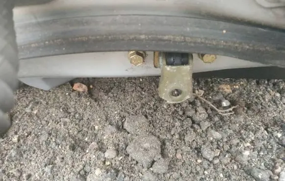 Front door check strap stopper