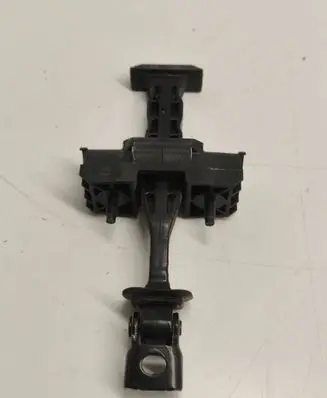 Front door check strap stopper