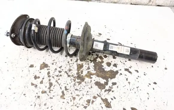 Volkswagen Golf VII Front shock absorber with coil spring 5Q0412014