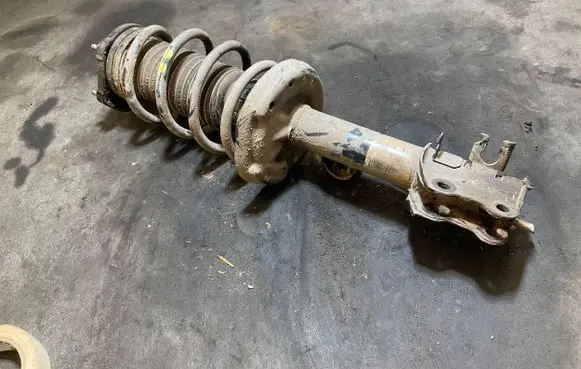 Front shock absorber with coil spring
