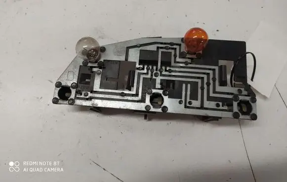 Tail light bulb cover holder