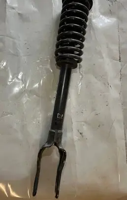 Front shock absorber with coil spring