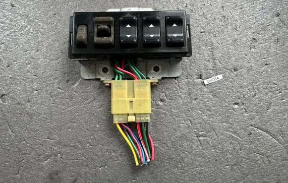 Mitsubishi Pajero Front door window switch trim MB605564