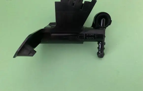 Headlight washer spray nozzle