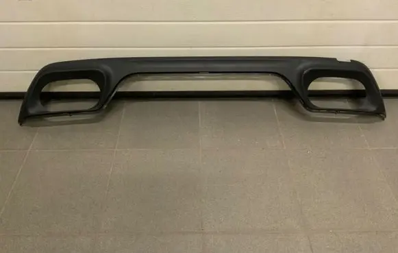 Rear bumper trim bar molding