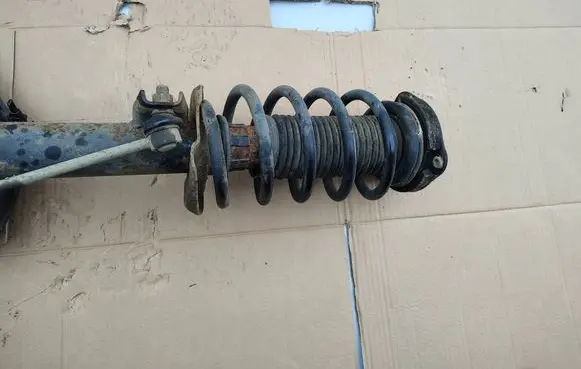 Volkswagen Caddy Front shock absorber with coil spring