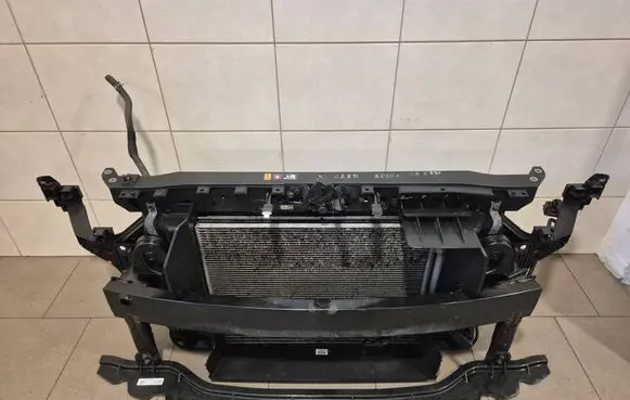 Radiator support slam panel
