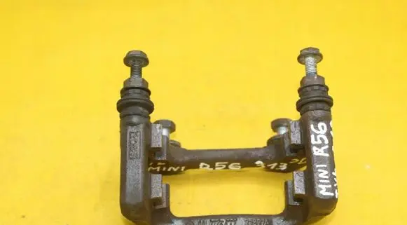 Mini One - Cooper Coupe R56 Brake caliper pad carrier rear 