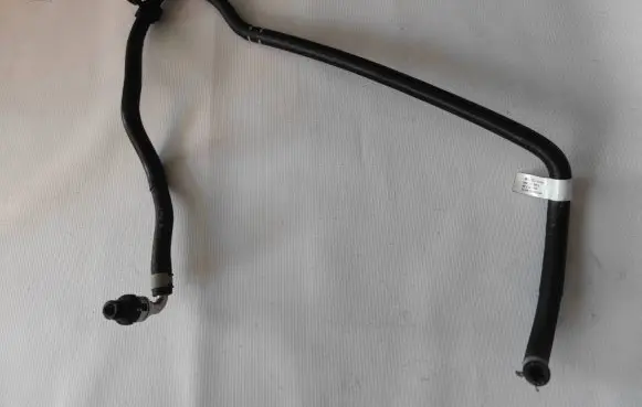 Volkswagen Golf VII Engine coolant pipe/hose 06K133986EB