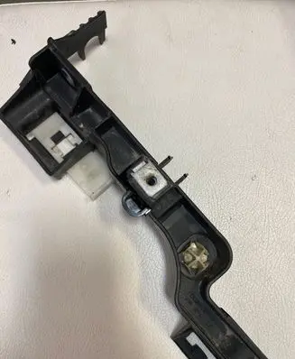 Dodge RAM Headlight/headlamp mounting bracket 1002403AG