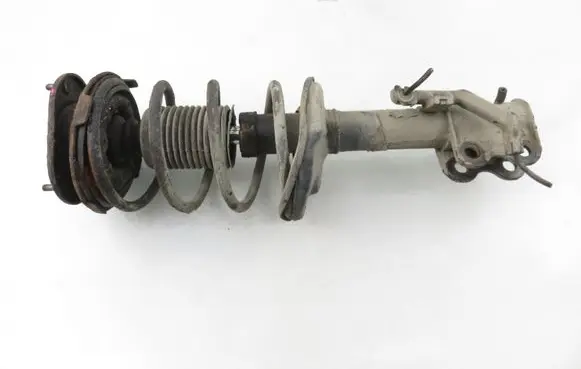 Toyota Corolla E110 Front shock absorber with coil spring 
