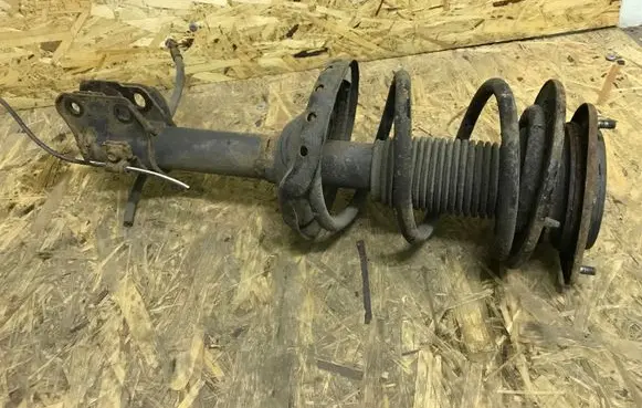 Subaru Outback Front shock absorber with coil spring