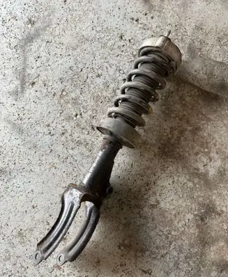 Front shock absorber with coil spring