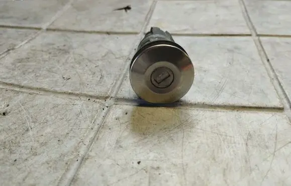 Mitsubishi Colt Front door lock (next to the handle) 
