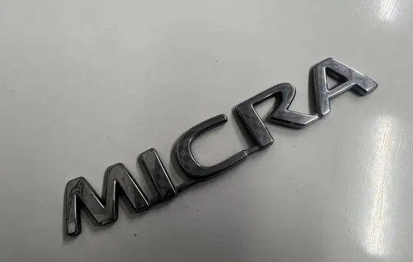 Nissan Micra Manufacturer badge logo/emblem 90892AX600