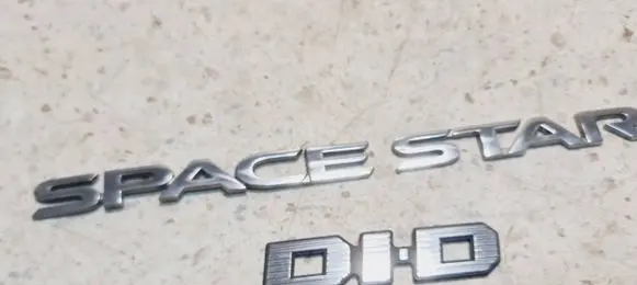Mitsubishi Space Star Manufacturers badge/model letters 