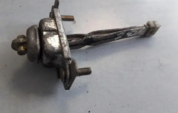 Mazda 323 F Rear door check strap stopper