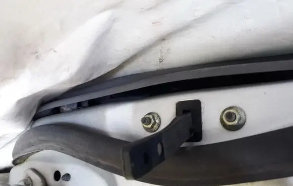 Mazda 323 F Rear door check strap stopper